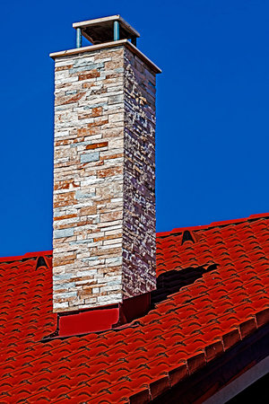 Decorative chimney on building a new roof of home.の写真素材