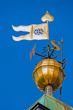 Metal signs with cardinal points and flag, placed on the clock tower in Novi Sad, to be visible for...
