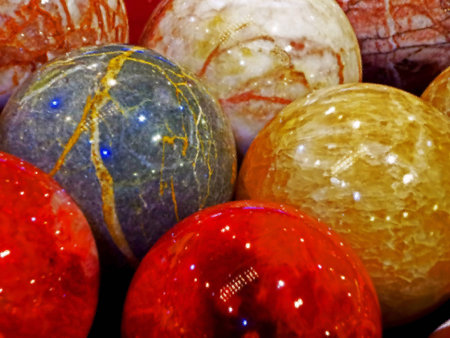 Energy stones polished in round shape and placed behind a glass.