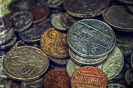 Old coins of different Nationalities, from different periods. Image digitally manipulated as one old photo.の写真素材