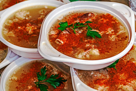 Servings overlapping with Romanian jelly aspic, decorated with fresh parsley leaves and grinded red...