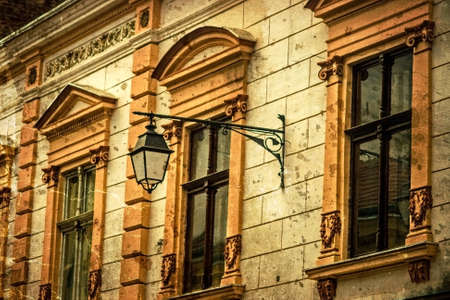 Old photo with architectural details on a historic building in Union Square, Timisoara, Romania. Image digitally manipulated as one old photo.の写真素材