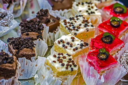 Various sweets with cream, chocolate and fruits.の写真素材
