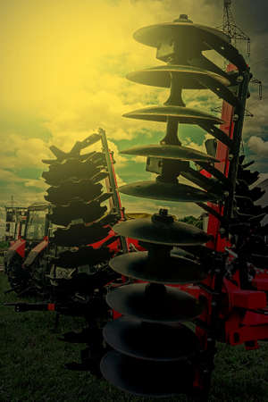 Agricultural equipment in sunset light. Image digitally manipulated.の写真素材