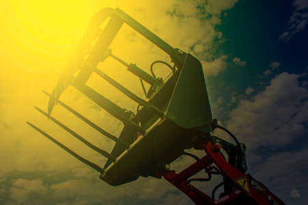 Agricultural equipment in sunset light. Image digitally manipulated.の写真素材