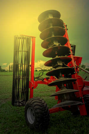 Agricultural equipment in sunset light. Image digitally manipulated.の写真素材