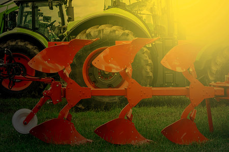 Agricultural equipment in sunset light. Image digitally manipulated.