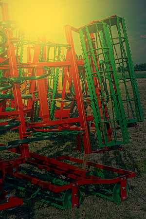 Agricultural equipment in sunset light. Image digitally manipulated.