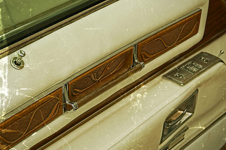 Old postcard with detail of a door opener from inside at one vintage car. Vintage processed.の写真素材