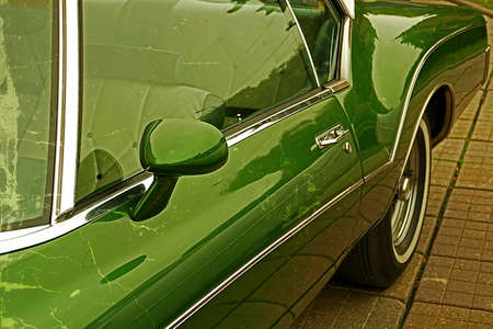 Old postcard with one luxury old car presented to one street exhibition in Timisoara, Romania. Detail. Vintage processed.の写真素材