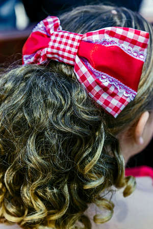 Young girl from California with hair decorated with a traditional bow.の写真素材