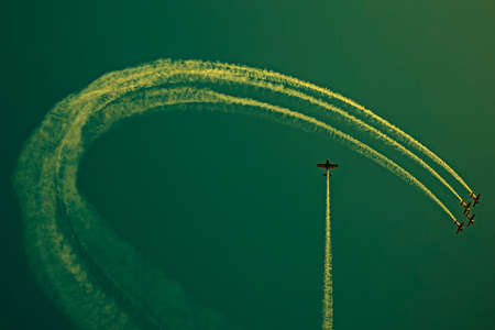 Drawings of smoke in the sky made from airplanes at a airshow demonstration.Vintage processed.の写真素材