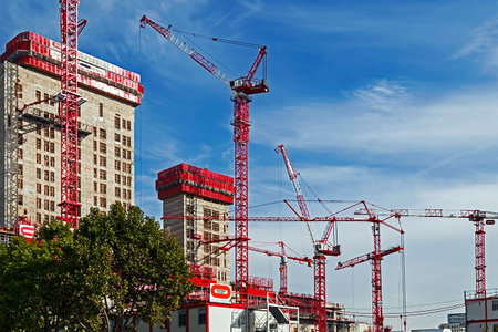 PARIS, FRANCE - OCTOBER 12, 2015: Cranes and multi storey building works on a construction site in...