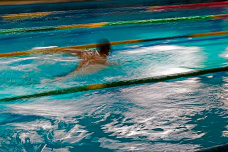Abstract motion a swimmer in a pool.の写真素材