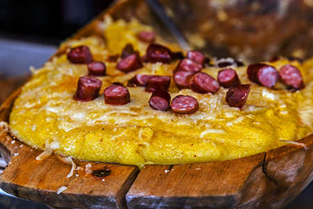 Romanian traditional polenta in a traditional wooden pot.の写真素材
