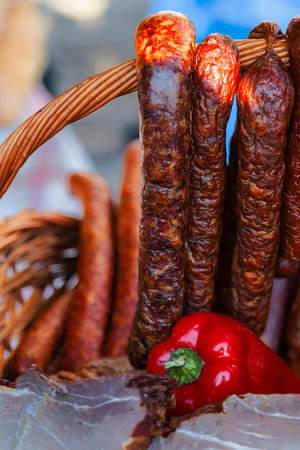 Traditional romanian sausages specialty, placed in a wicker basket. Shall specify for the month of...