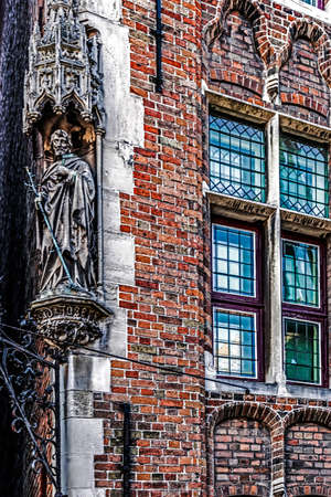 BRUGES, BELGIUM - OCTOBER 13, 2015: Building facade from historic center of Bruges, Belgium.のeditorial素材