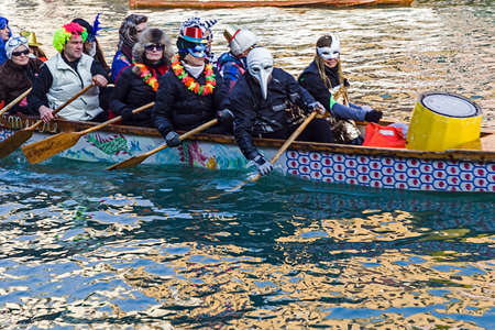 VENICE, ITALY - JANUARY 24, 2016: Carnival procession on the Cannaregio Canal on January 24, 2016 in Venice Italyのeditorial素材