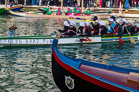 VENICE, ITALY - JANUARY 24, 2016: Funny carnival procession on the Cannaregio Canal on January 24, 2016 in Venice Italyのeditorial素材