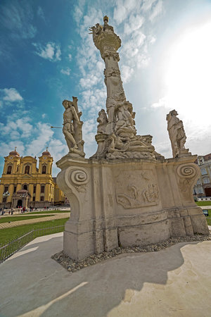 TIMISOARA, ROMANIA - MARCH 20, 2016: Holy Trinity Statue and German Dome located on Union Square in...
