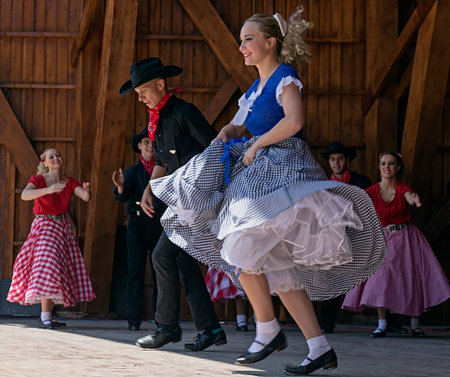 ROMANIA, TIMISOARA-JULY 12, 2015:Unidentified youths from California in traditional dress, presented...
