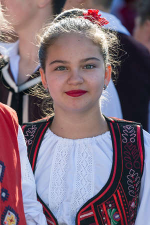 ROMANIA, TIMISOARA - JULY 7, 2016: Teenager from Romania in traditional costume, present at the international folk festival, " International Festival of hearts " organized by the City Hall Timisoara.のeditorial素材