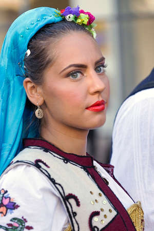 ROMANIA, TIMISOARA - JULY 7, 2016: Young girl from Serbia in traditional costume, present at the international folk festival, " International Festival of hearts " organized by the City Hall Timisoara.のeditorial素材