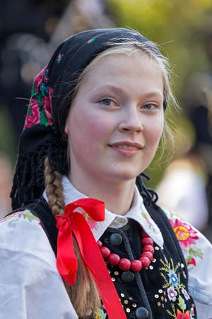 ROMANIA, TIMISOARA - JULY 7, 2016: Young girl from Poland in traditional costume, present at the international folk festival, " International Festival of hearts " organized by the City Hall Timisoara.のeditorial素材