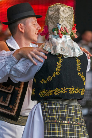 ROMANIA, TIMISOARA - JULY 7, 2016: Young Romanian dancers in traditional costume, perform folk dance...