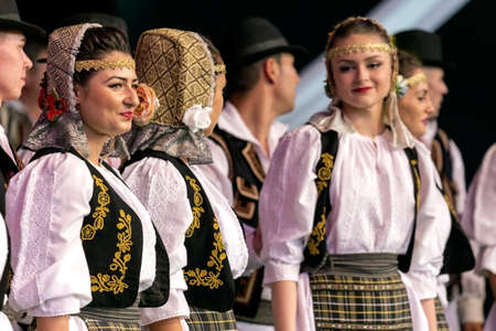 ROMANIA, TIMISOARA - JULY 7, 2016: Young Romanian dancers in traditional costume, perform folk dance during "International Festival of hearts" , July 7, 2016 in Timisoara.のeditorial素材