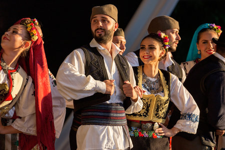 TIMISOARA, ROMANIA - JULY 7, 2016: Young Serbian dancers in traditional costume, perform folk dance during " International Festival of hearts " organized by the City Hall Timisoara.のeditorial素材