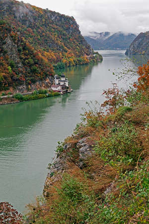 Autumn at the Danube Gorges, the border between Romania and Serbia. View from Serbian part. In the background, on the Romanian bank, monastery Mraconia.の写真素材