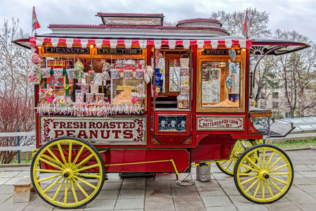 BELGRADE, SERBIA - MARCH 18, 2017: Funny carriage with lots of colorful lollies on display for sale. Homemade sweets.のeditorial素材