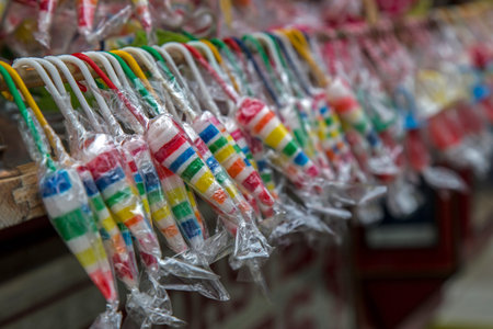 Lots of colorful lollies on display for sale. Homemade sweets.