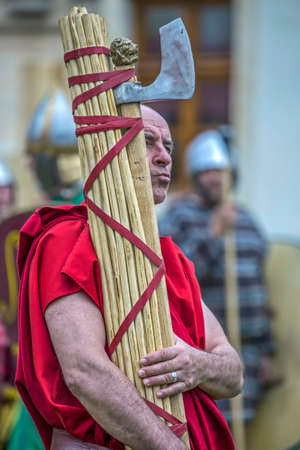 ALBA IULIA, ROMANIA - APRIL 29, 2017: Carrier of Roman antic symbols in one demonstration at APULUM ROMAN FESTIVAL, organized by the City Hall.のeditorial素材