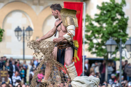 ALBA IULIA, ROMANIA - APRIL 30, 2017: Roman gladiator make one fight demonstration at APULUM ROMAN FESTIVAL, organized by the City Hall.のeditorial素材