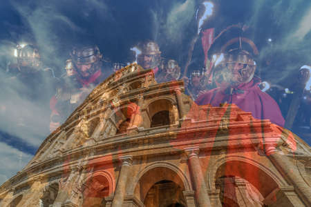 ALBA IULIA,ROMANIA - APRIL 30,2017:Double exposure with fisheye view outside the Colosseum and Roman soldiers in background.Antical theatrical scene at APULUM ROMAN FESTIVAL organized by the City Hallのeditorial素材