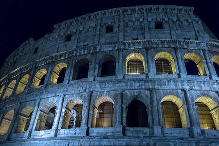 Fisheye night view outside the Colosseum, Rome, Italy, with specific ruins and lights blue and yellow.の写真素材