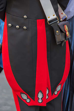 Detail of a protocol uniform of an Italian soldier. Black and red.の写真素材