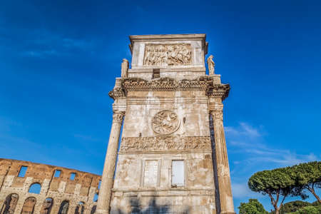 View of the arch of Constantine, near the Coliseum in Rome, Italy. Sky with clouds in background.の写真素材