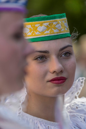 TIMISOARA, ROMANIA - JULY 6, 2017: Young dancer girls from Belarus in traditional costume present at the international folk festival "International Festival of hearts" organized by the City Hall.のeditorial素材