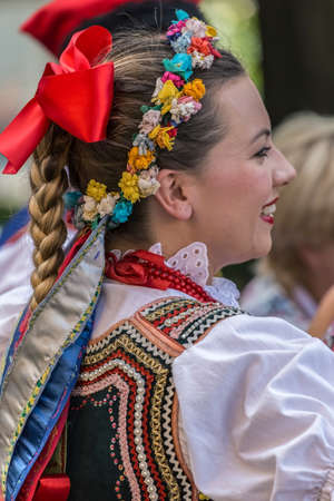 TIMISOARA, ROMANIA - JULY 6, 2017: Young dancer girl from Poland in traditional costume present at the international folk festival "International Festival of hearts" organized by the City Hall.のeditorial素材