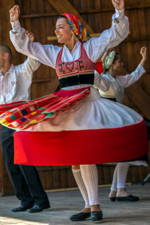 TIMISOARA, ROMANIA - JULY 9, 2017: Dancer girl from Portugal in traditional costume perform at the international folk festivalのeditorial素材