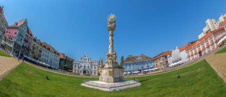 TIMISOARA, ROMANIA - AUGUST 16, 2017: Panoramic view of one part at Union Square in Timisoara, Romania, with old buildings. Trinity Statue and serbian vicariate in foreground.のeditorial素材
