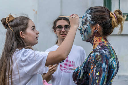 TIMISOARA, ROMANIA - SEPTEMBER 8, 2017: Face and body painting of a woman. 3D art symbolizing on live at the street, inside the CheckART Carnival organized by the City Hall Timisoara. Liberty Square.のeditorial素材