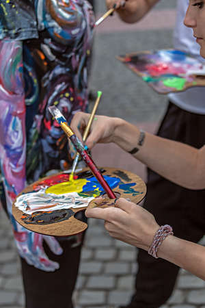 TIMISOARA, ROMANIA - SEPTEMBER 8, 2017: Girls make body painting of a woman. 3D art symbolizing on live at the street, inside the CheckART Carnival organized by the City Hall Timisoara. Liberty Squareのeditorial素材