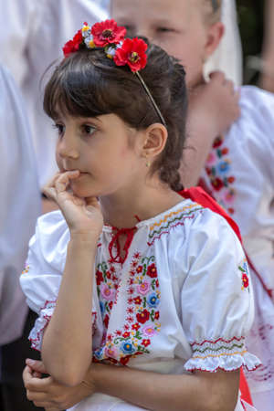 ROMANIA, TIMISOARA - JUNE 11, 2017: Nice attitude of one young Romanian girl in traditional folk costume present at traditional event ,,Festival of ethnics" organized by the City Hall Timisoara.のeditorial素材