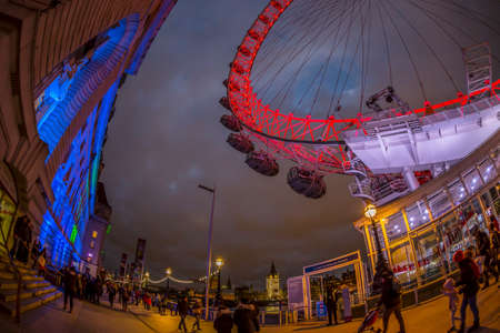 LONDON, ENGLAND - NOVEMBER 27, 2017: County Hall and London Eye illuminated in night at the boarding-descent point.Giant Ferris wheel on the Bank of the River Thames has 135m tall and 120m in diameterのeditorial素材
