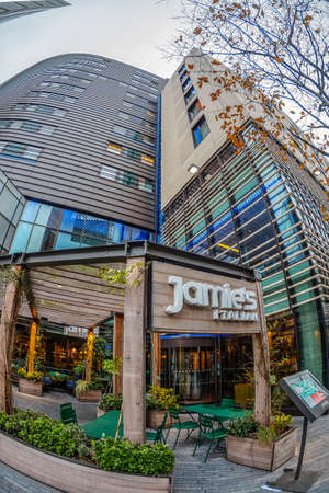 LONDON, ENGLAND - NOVEMBER 27, 2017: Entrance in Jamie's Italian restaurant located on Hilton London Tower Bridge, 5 More London Place, Tooley Street, SE1 2BY.のeditorial素材