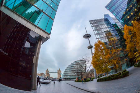 LONDON, ENGLAND - NOVEMBER 27, 2017: Modern and spectacular office buildings on More London Riverside. City Hall building and Tower Bridge on background.のeditorial素材
